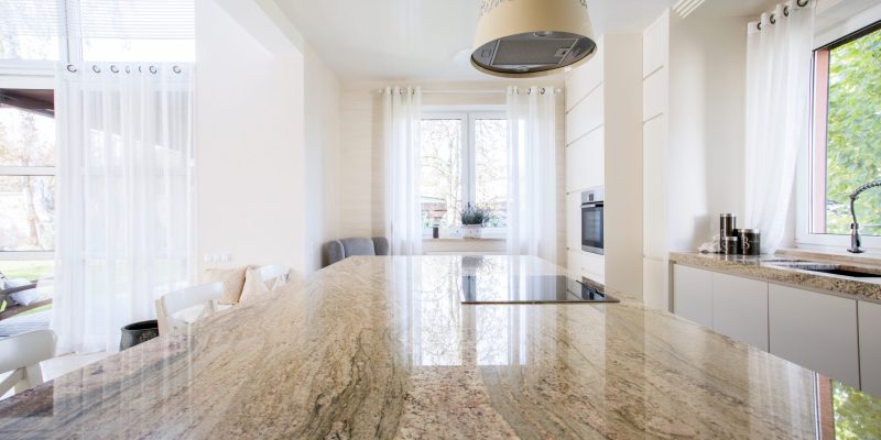 Granite worktop inside white light apartment